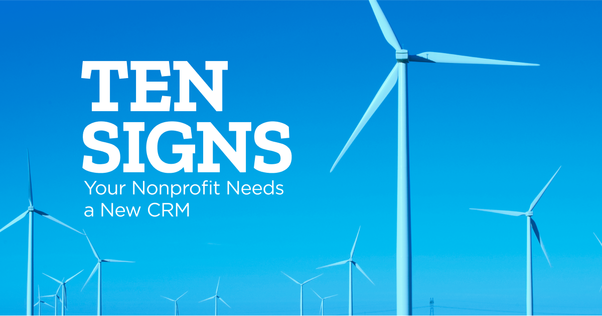 Many windmills are visible against a blue sky. Overlaid text reads "Ten Signs Your Nonprofit Needs a New CRM"