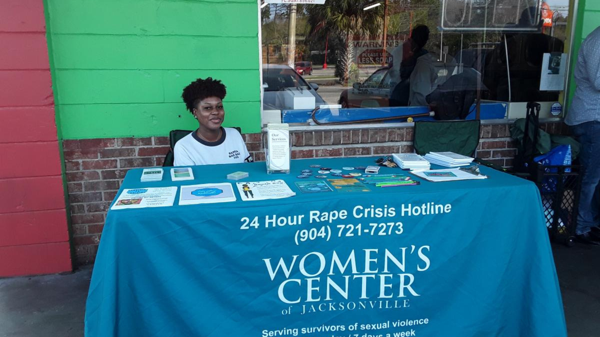 Women’s Center of Jacksonville table and volunteer