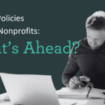 Shifting Tax Policies Shaping Nonprofits: What’s Ahead? Image shows a man working at a desk.