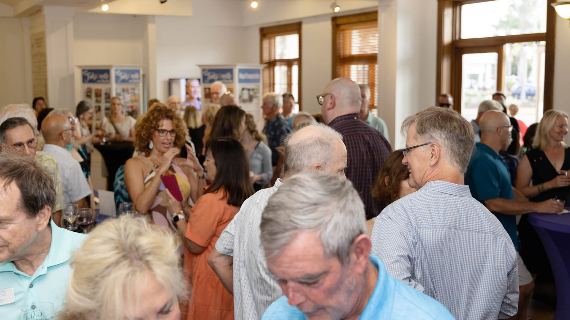 Beaches Area Historical Society. Image shows an event with lots of people socializing.
