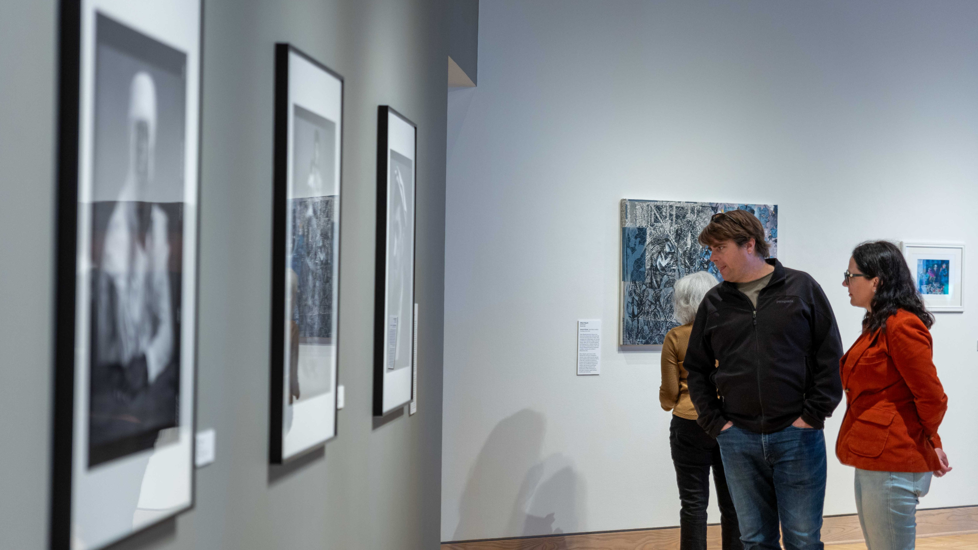 Ohio Arts Council. Image shows people looking at art.
