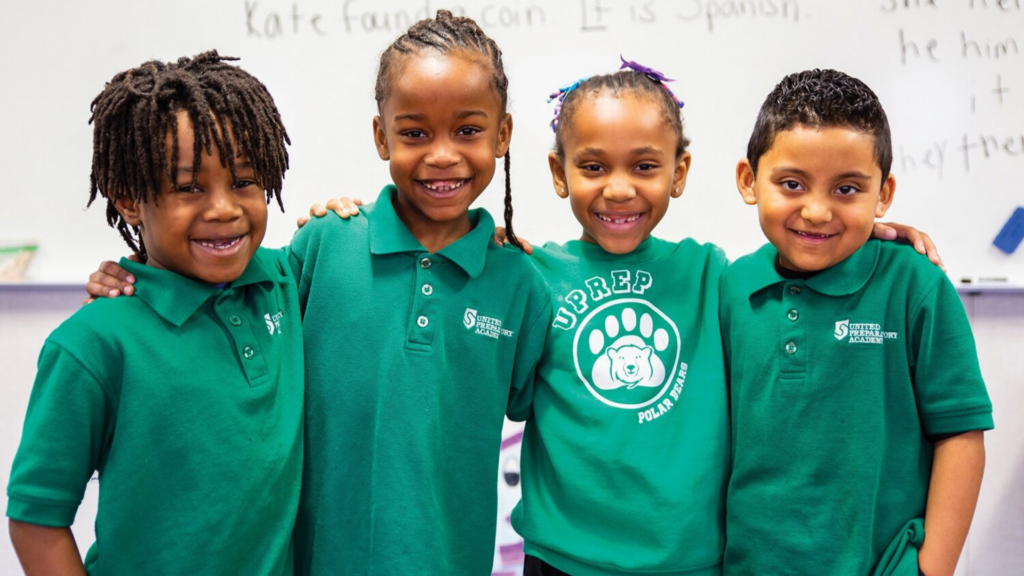 United Schools Network. Image shows students smiling.