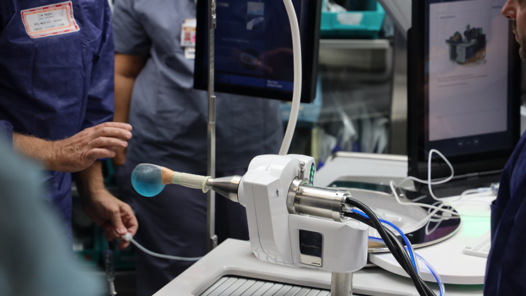 Massey Cancer Center. Image shows scientists conducting an experiment.