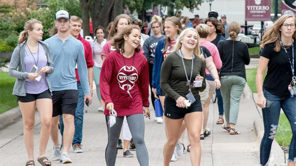 Viterbo University. Image shows group of students walking on campus.