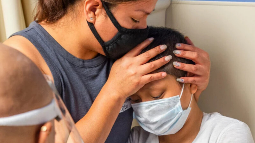 Children’s Hospital Colorado Foundation. Image shows a mother comforting her child.