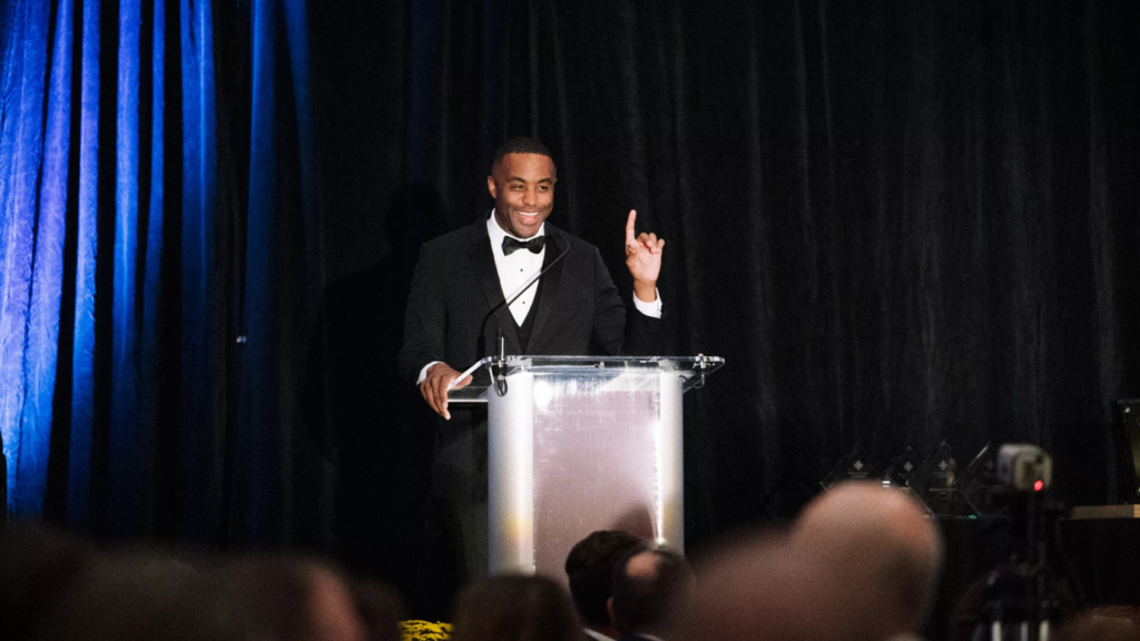 Delaware County Foundation. Image shows a man presenting at a gala.