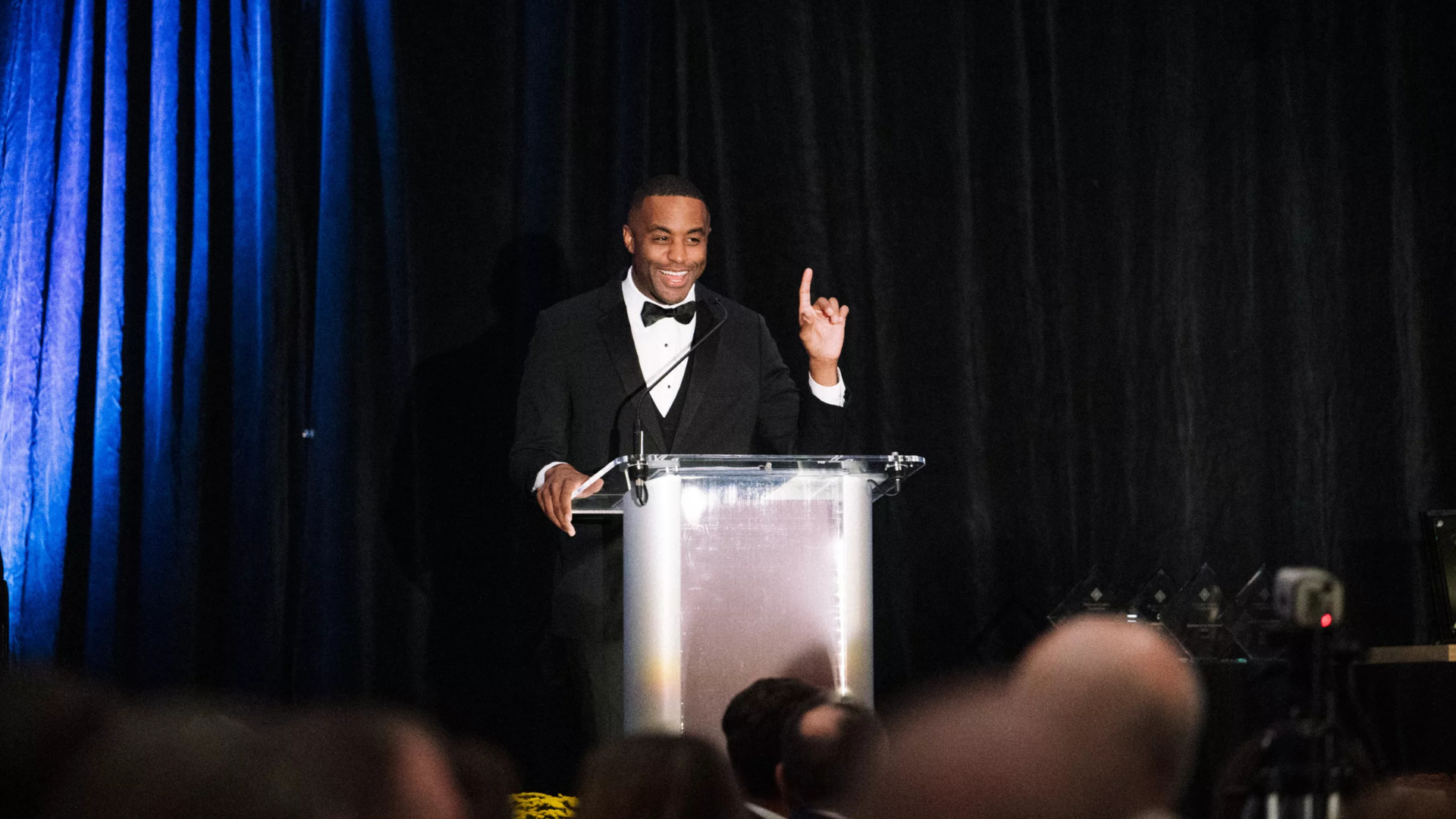 Delaware County Foundation. Image shows a man presenting at a gala.
