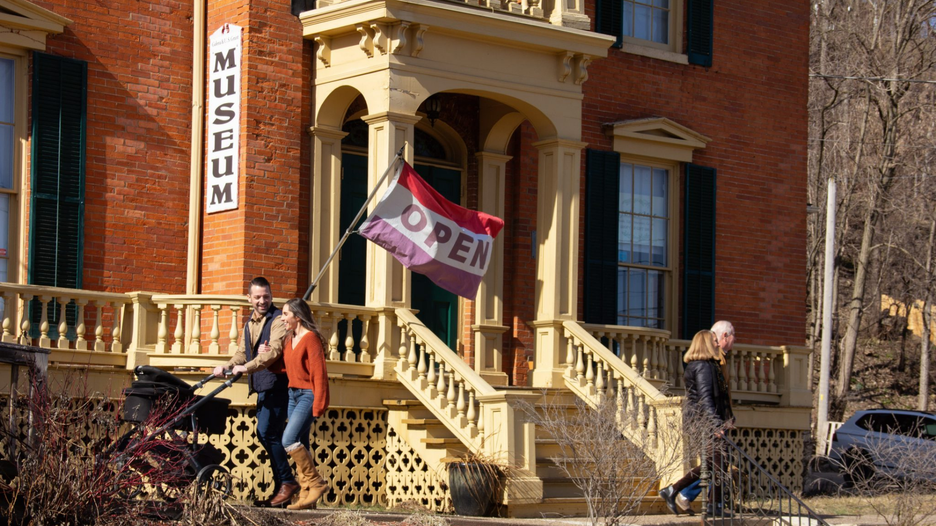 Galena-Jo Daviess County Historical Society. Image shows families smiling walking by the museum.