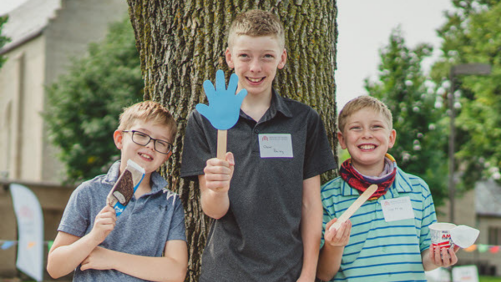 House of Hope Presbyterian Church. Image shows three boys smiling.