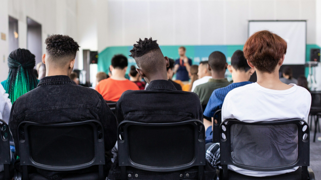 Inspireducation. Image shows students at the back of a classroom.