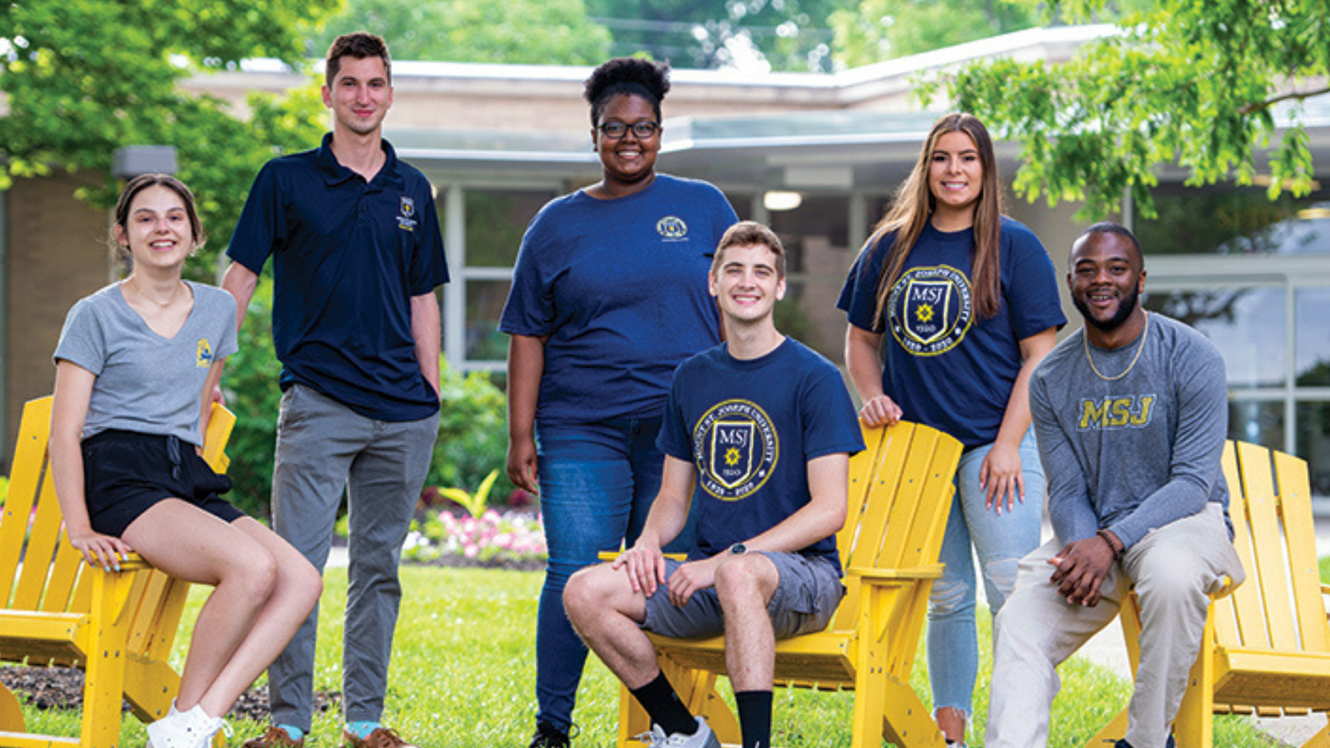 Mount St. Joseph University. Image shows students smiling outdoors.
